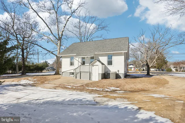 a view of a house with a snow in the yard