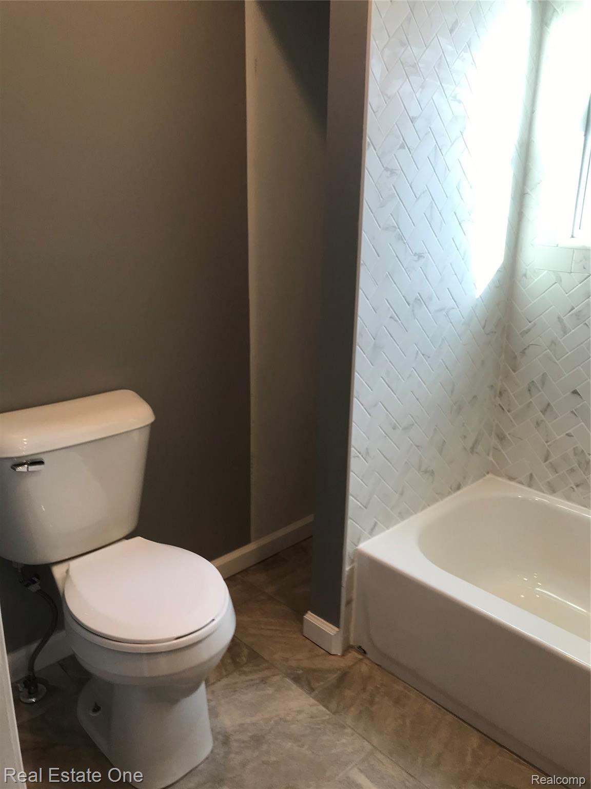 21251 Haggerty Road Belleville, MI 48111 - Photo 15 of 19 New toilet & linen closet.