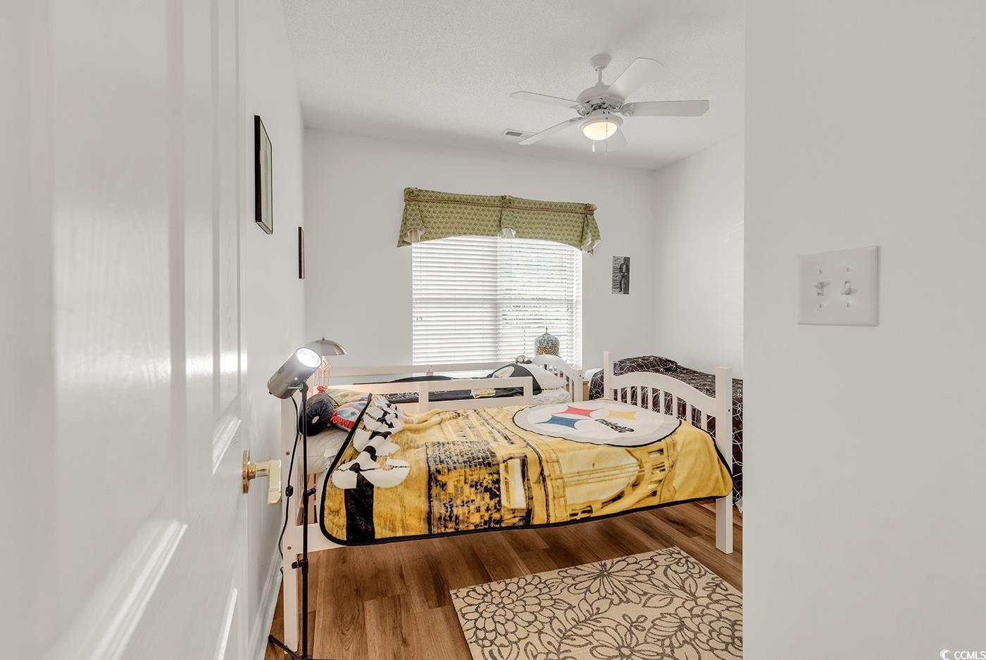 1459 St Thomas Circle, Unit F2 Myrtle Beach, SC 29577 - Photo 18 of 31 Bedroom with LVP flooring and ceiling fan