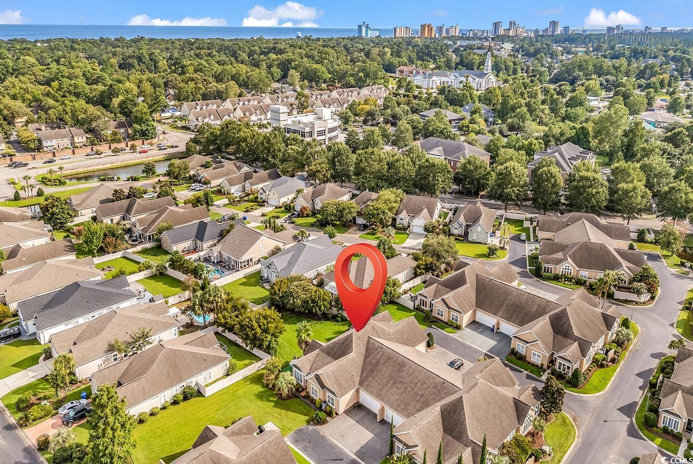 1459 St Thomas Circle, Unit F2 Myrtle Beach, SC 29577 - Photo 28 of 31 Aerial view of residential area with a nearby beach and skyline