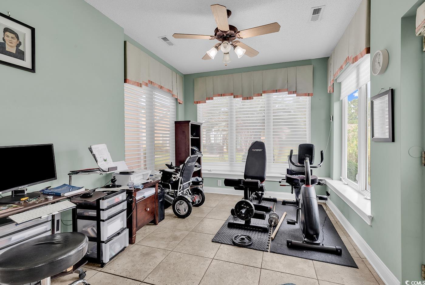 1459 St Thomas Circle, Unit F2 Myrtle Beach, SC 29577 - Photo 10 of 31 Featuring tile flooring, a ceiling fan, and access to private patio/backyard area