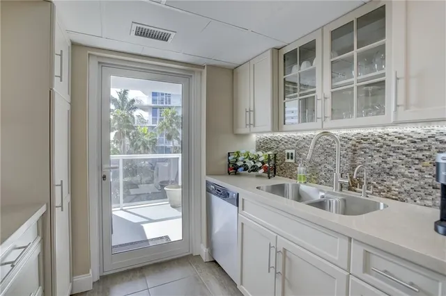 a kitchen with a sink and cabinets