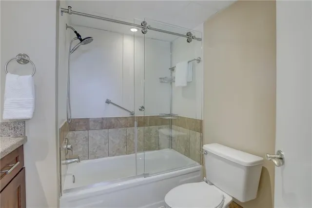 a bathroom with a shower and a toilet