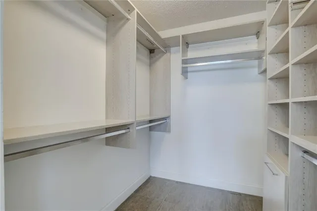 a view of an empty walk in closet