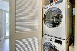 a view of a balcony with two chairs and a table