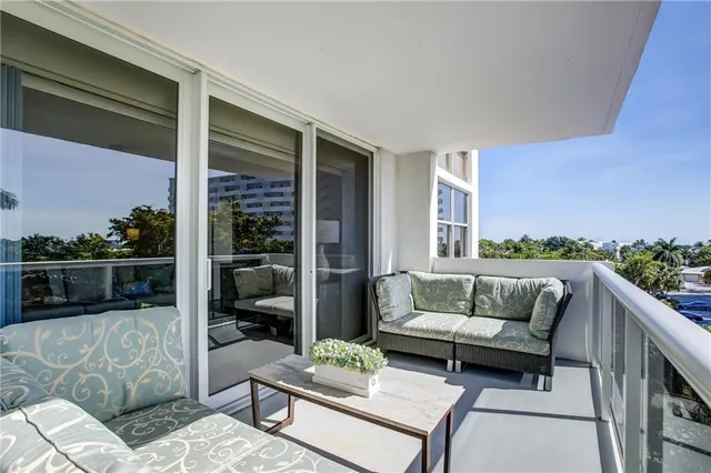 a view of balcony with furniture