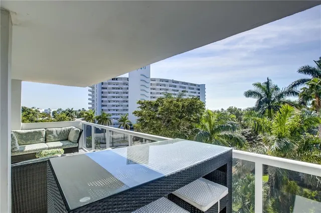 a view of a swimming pool and lounge chair