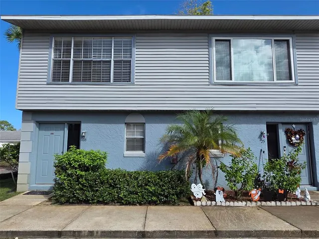 a front view of a house with a garage