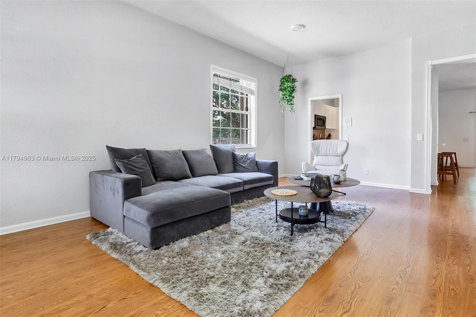 4458 Stone Ridge Way Weston, FL 33331 - Photo 8 of 45 a living room with furniture and wooden floor