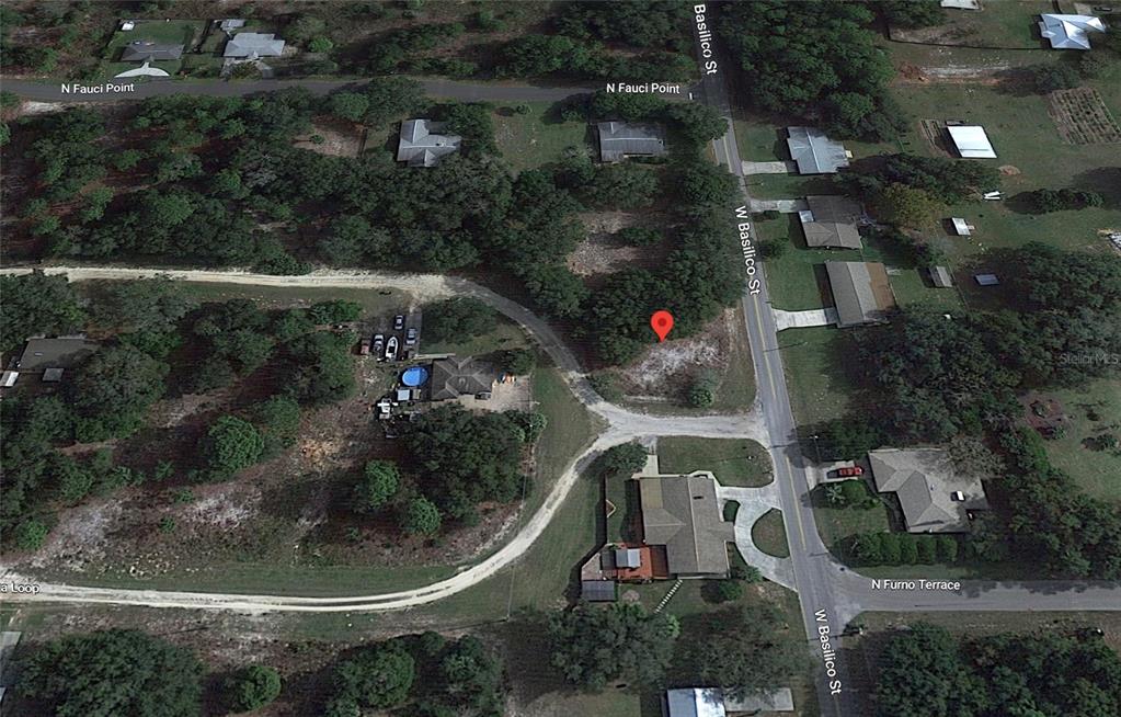 8549 North Buscetta Loop Crystal River, FL 34428 - Photo 8 of 12 an aerial view of a house with a yard