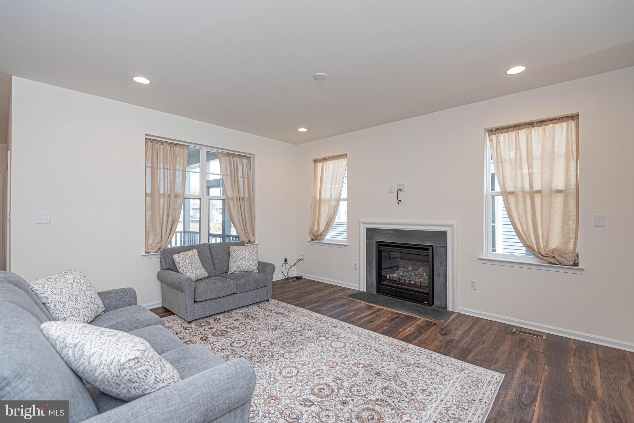 211 Prospect Street Milton, DE 19968 - Photo 14 of 64 a living room with furniture and a fireplace