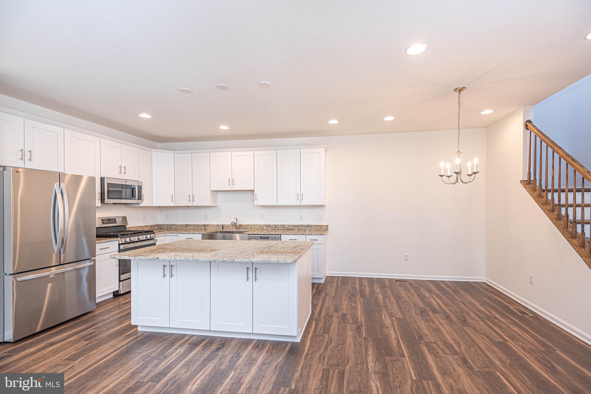 211 Prospect Street Milton, DE 19968 - Photo 16 of 64 a kitchen with a sink window and stainless steel appliances