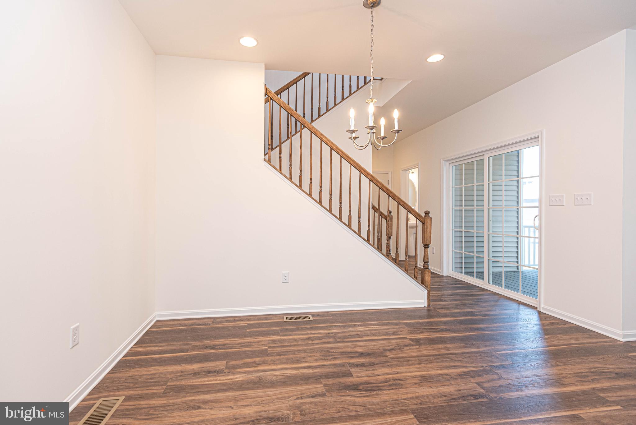 211 Prospect Street Milton, DE 19968 - Photo 21 of 64 a view of entryway and hall with wooden floor