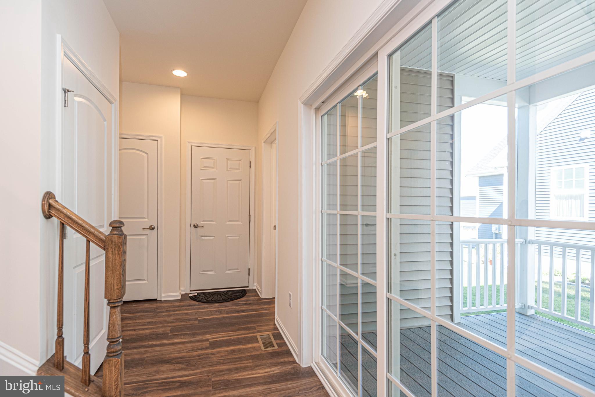 211 Prospect Street Milton, DE 19968 - Photo 23 of 64 a view of a hallway with wooden floor and windows