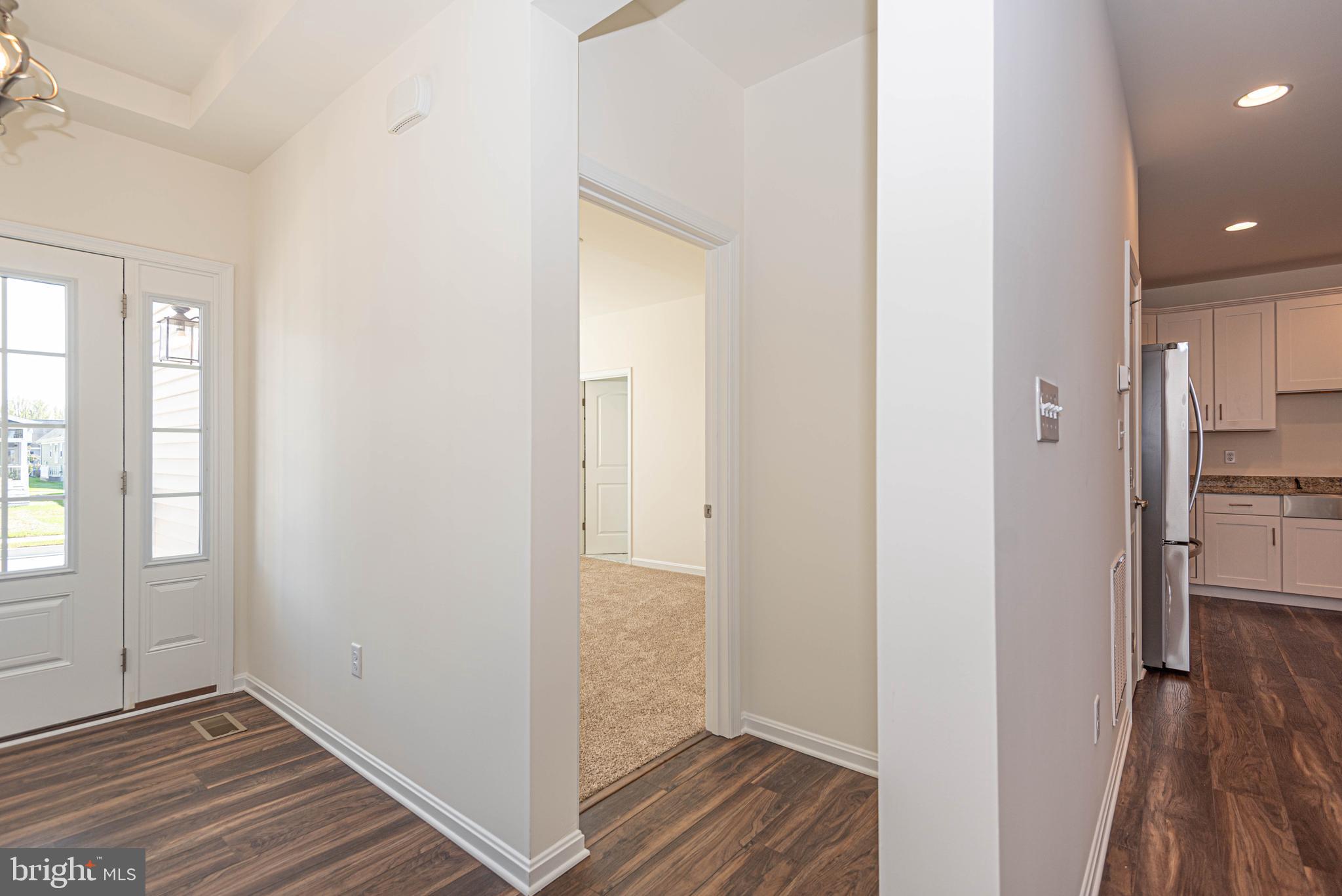 211 Prospect Street Milton, DE 19968 - Photo 27 of 64 a view of hallway with wooden floor