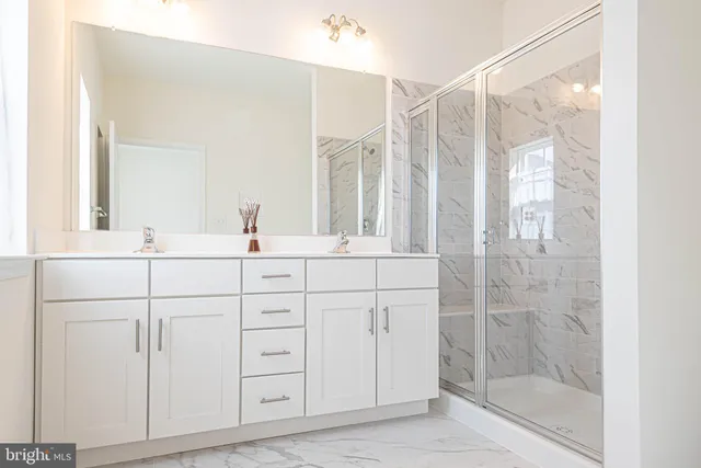 a view of staircase with wooden floor and white walls