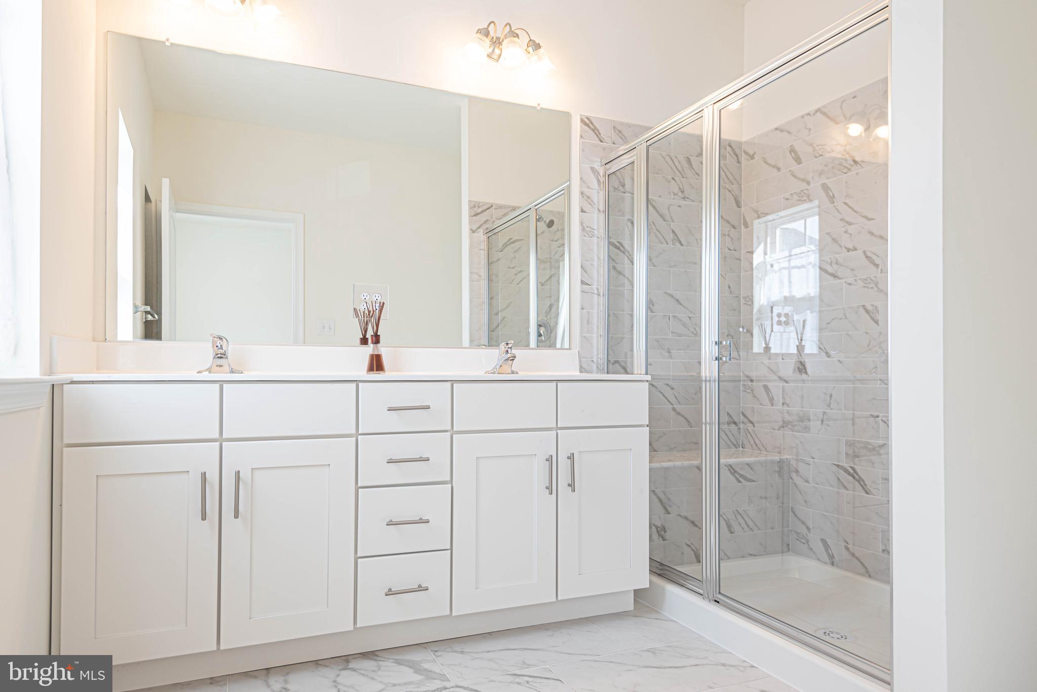 211 Prospect Street Milton, DE 19968 - Photo 31 of 64 a bathroom with a shower sink and mirror