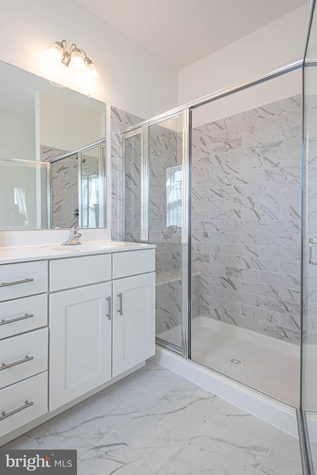 211 Prospect Street Milton, DE 19968 - Photo 32 of 64 a bathroom with a double vanity sink mirror and shower