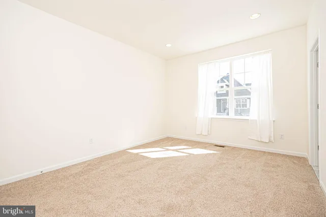 a view of staircase with white walls