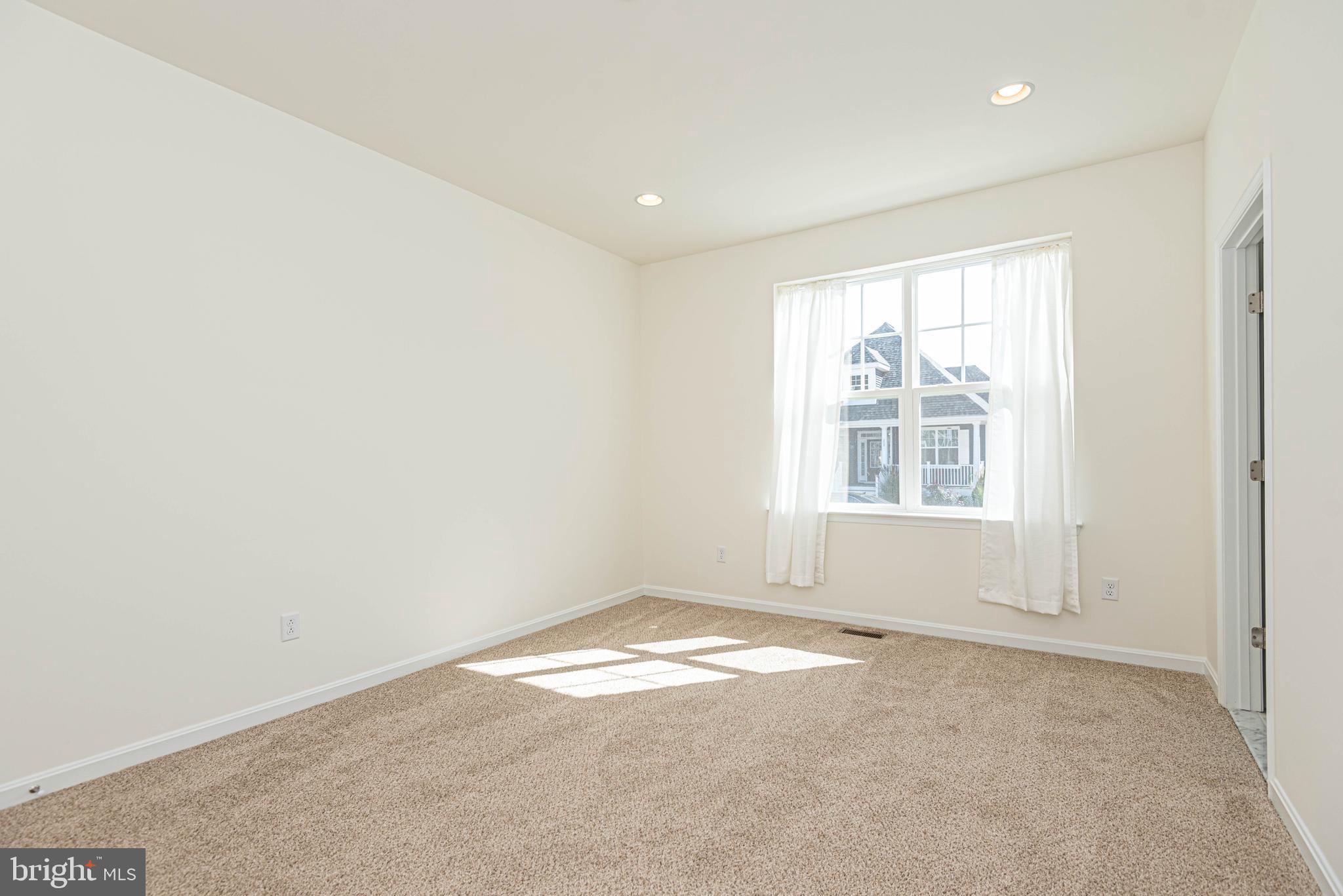 211 Prospect Street Milton, DE 19968 - Photo 37 of 64 an empty room with windows