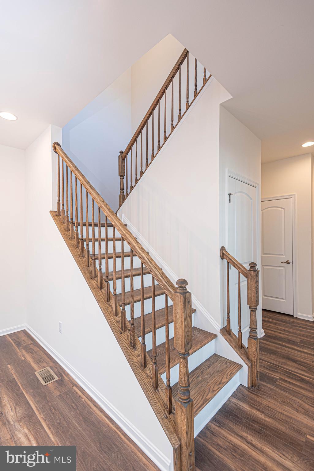 211 Prospect Street Milton, DE 19968 - Photo 38 of 64 a view of staircase with wooden floor and white walls