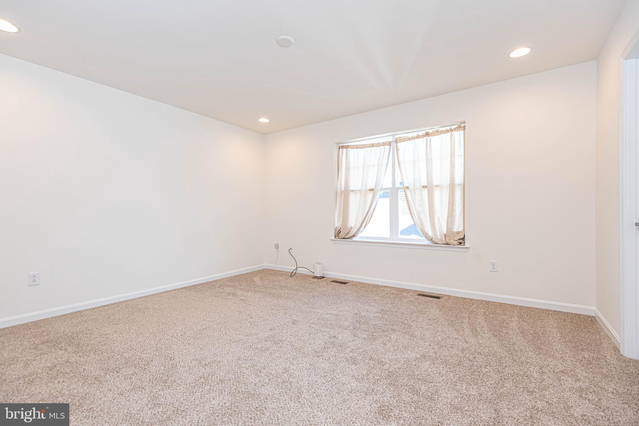 211 Prospect Street Milton, DE 19968 - Photo 50 of 64 an empty room with windows