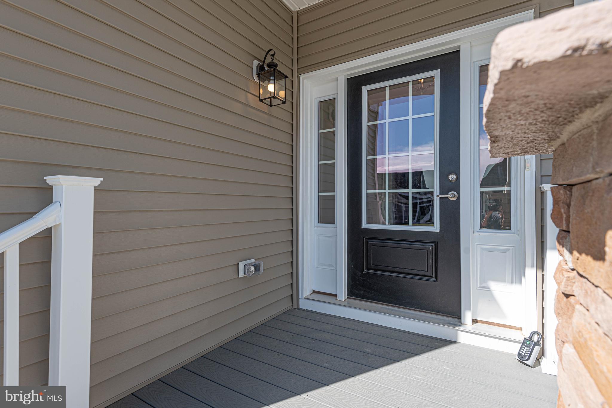 211 Prospect Street Milton, DE 19968 - Photo 5 of 64 a view of front door and porch