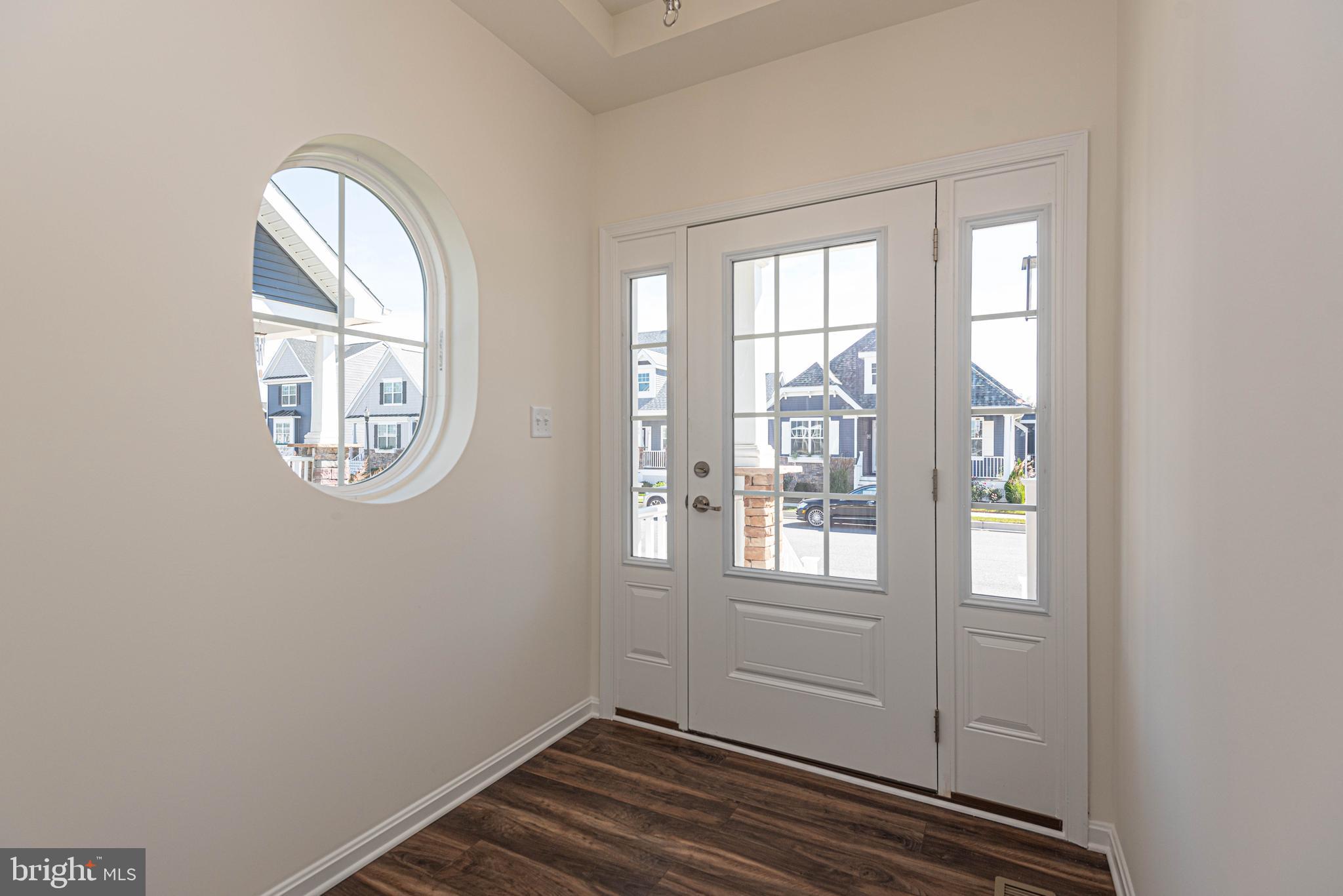 211 Prospect Street Milton, DE 19968 - Photo 7 of 64 an empty room with windows