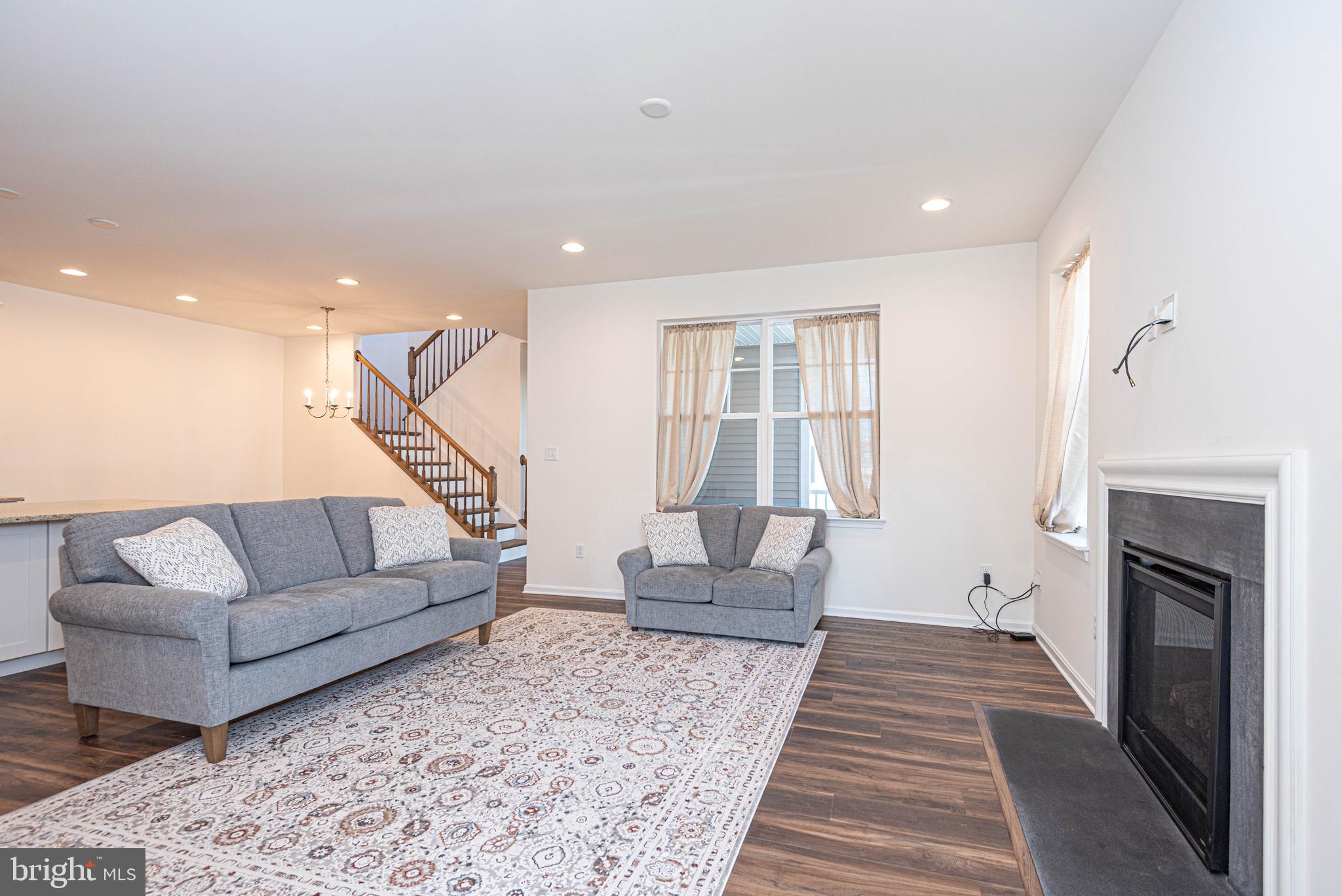 211 Prospect Street Milton, DE 19968 - Photo 10 of 64 a living room with furniture and a fireplace