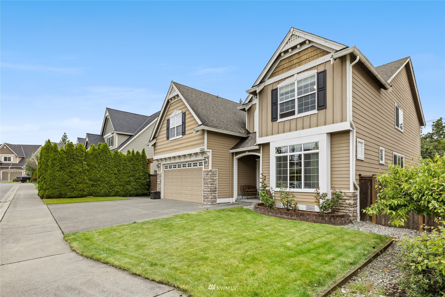 5418 Northeast 13th Place Renton, WA 98059 - Photo 34 of 36 a front view of a house with a yard