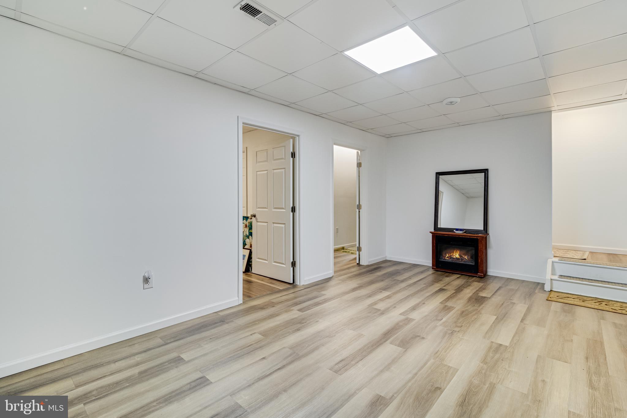 12015 Woodbury Road Nanjemoy, MD 20662 - Photo 27 of 53 a view of an empty room with wooden floor and a window