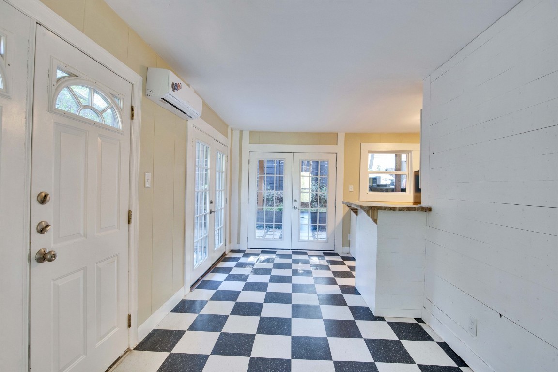 1115 Enfield Road, Unit A Austin, TX 78703 - Photo 11 of 21 a view of a big room with windows and mirror