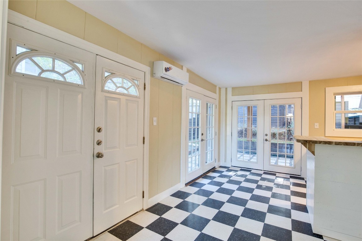 1115 Enfield Road, Unit A Austin, TX 78703 - Photo 12 of 21 a view of a big room with windows and chandelier