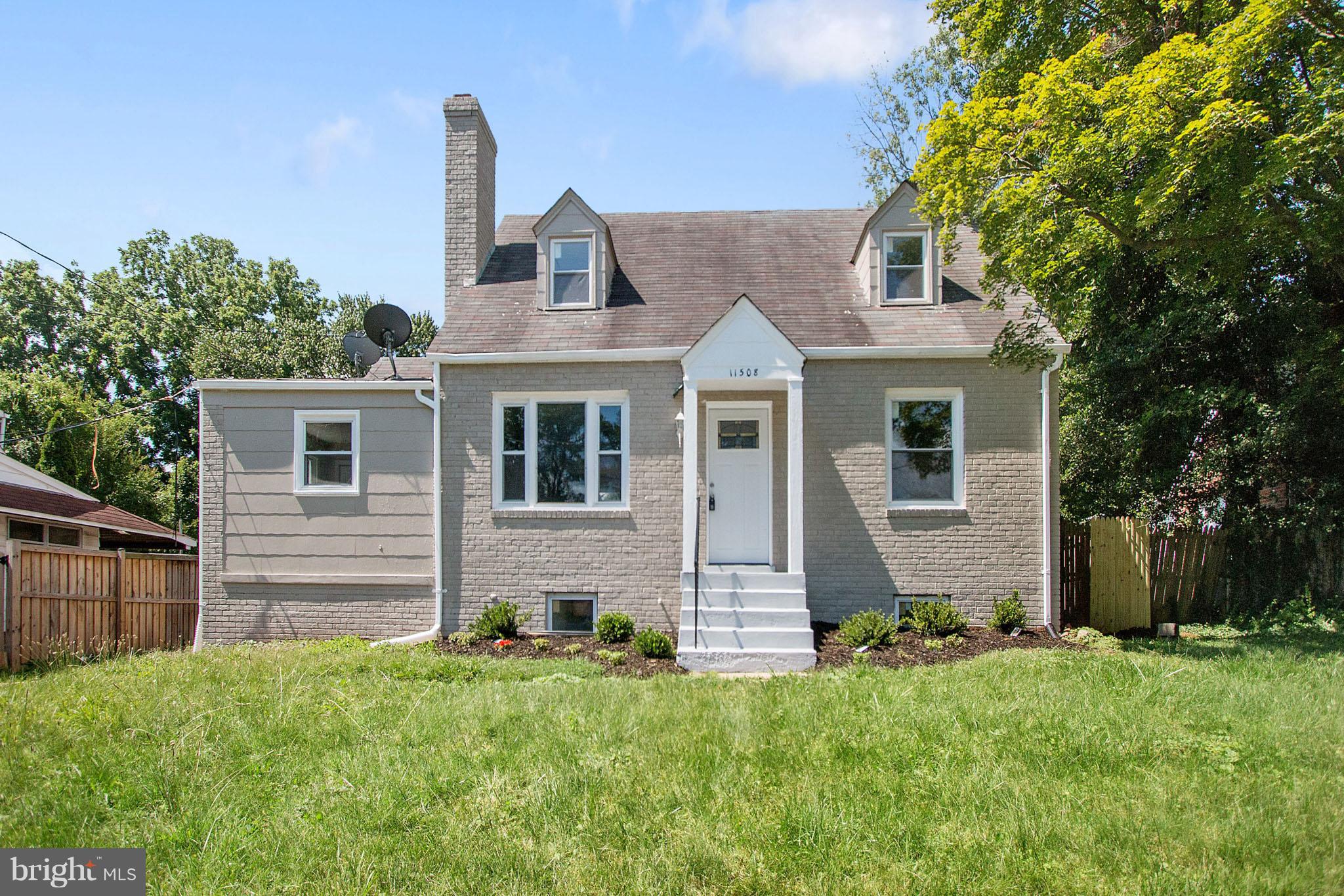 11508 Veirs Mill Road Silver Spring, MD 20902 - Photo 1 of 30 a front view of a house with a yard