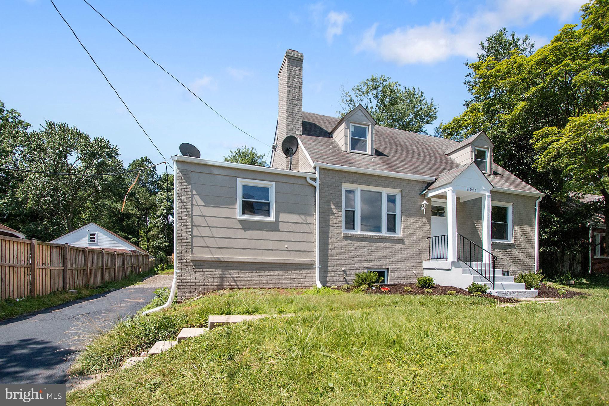 11508 Veirs Mill Road Silver Spring, MD 20902 - Photo 2 of 30 a front view of a house with a yard