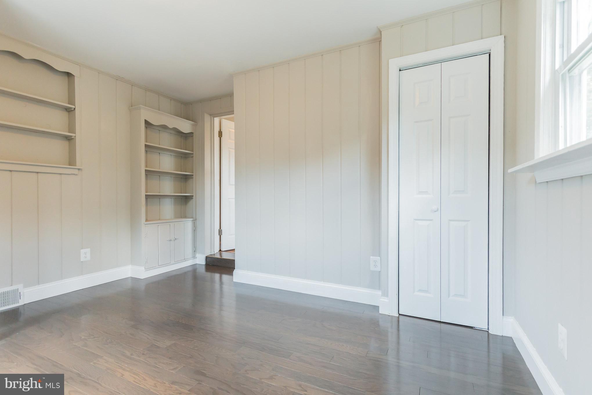 11508 Veirs Mill Road Silver Spring, MD 20902 - Photo 15 of 30 an empty room with wooden floor closet and windows
