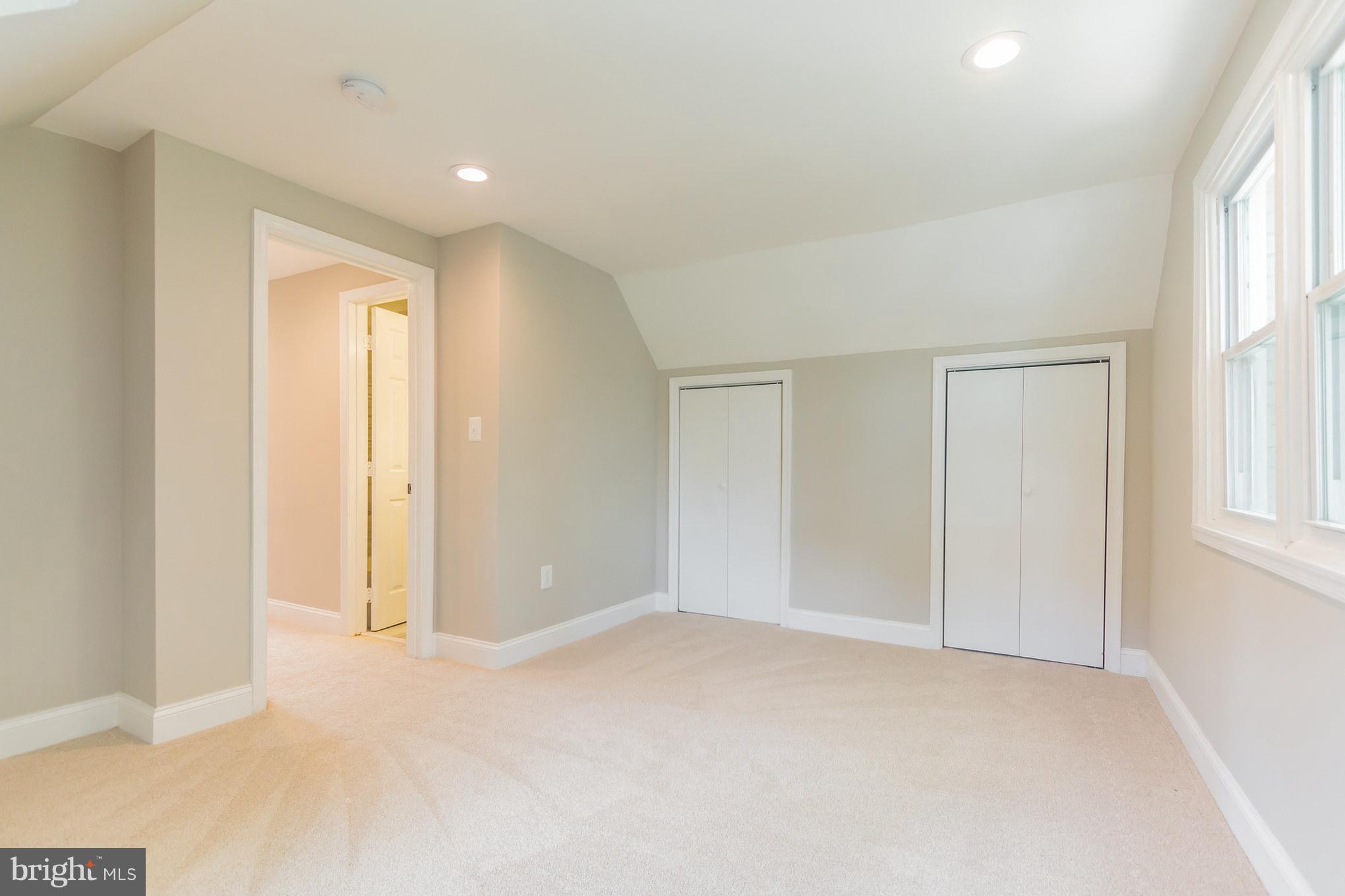 11508 Veirs Mill Road Silver Spring, MD 20902 - Photo 23 of 30 an empty room with windows and closet