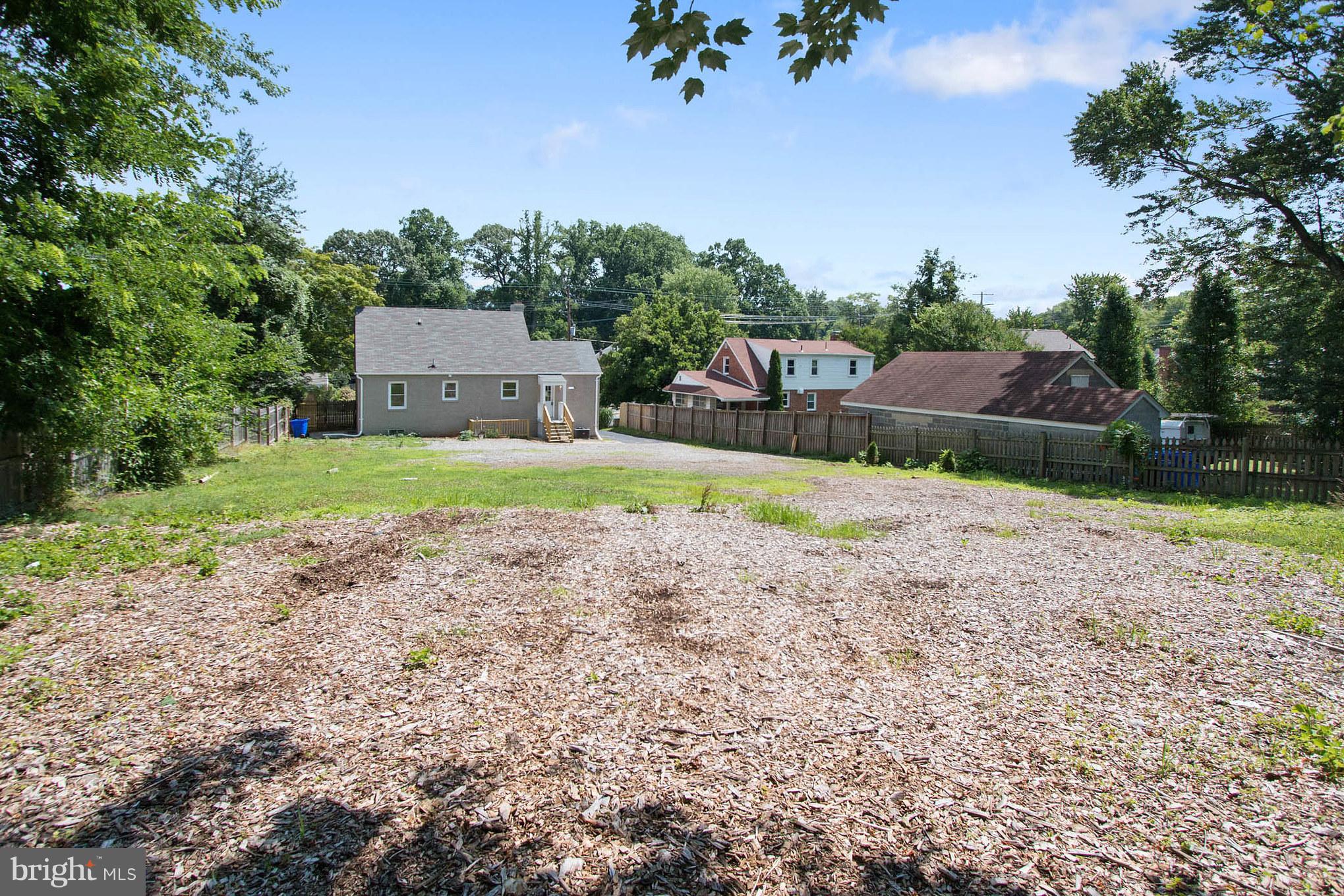 11508 Veirs Mill Road Silver Spring, MD 20902 - Photo 30 of 30 a front view of a house with a yard and garage