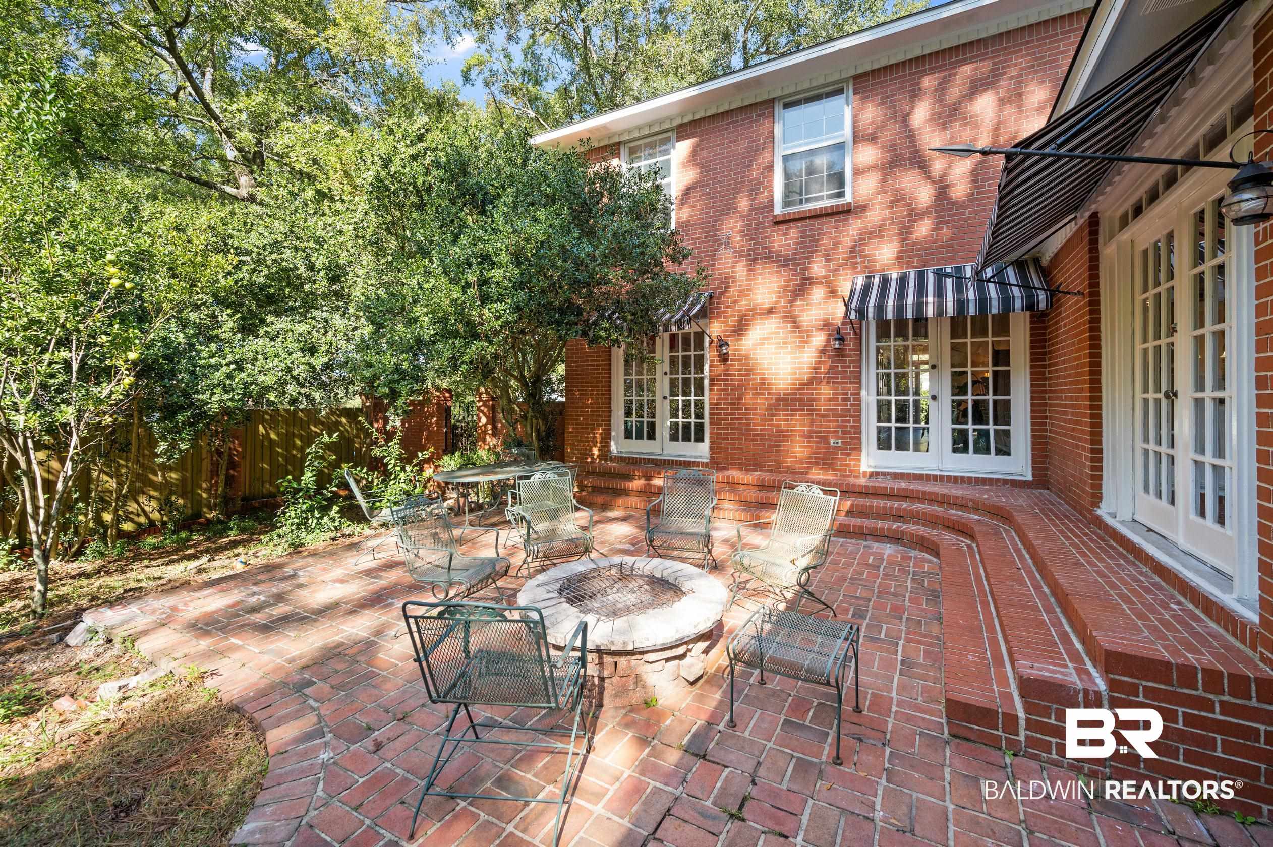 6705 Ridgeland Road South Mobile, AL 36695 - Photo 35 of 44 View of patio featuring an outdoor fire pit and french doors