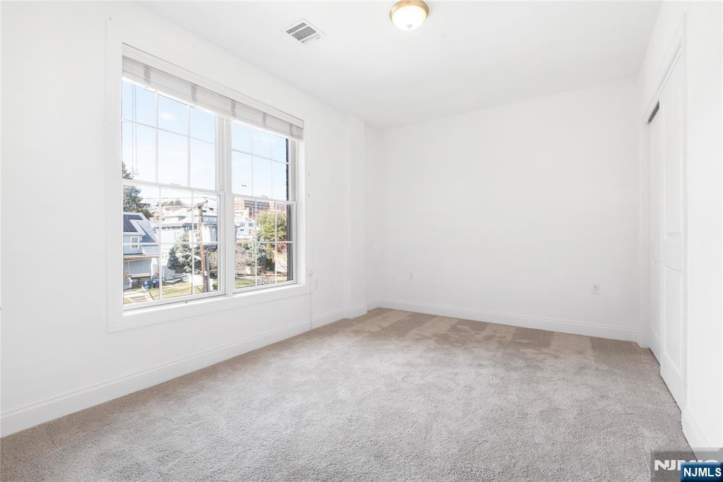 54 Polifly Road, Unit 311 Hackensack, NJ 07601 - Photo 17 of 20 an empty room with a window