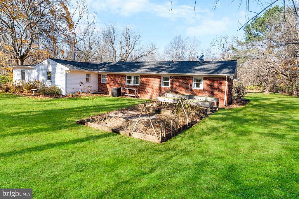 577 Brock Bridge Road Laurel, MD 20724 - Photo 33 of 41 a view of a house with backyard and a tree