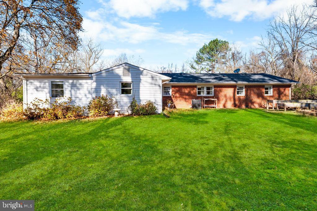 577 Brock Bridge Road Laurel, MD 20724 - Photo 34 of 41 a front view of a house with garden