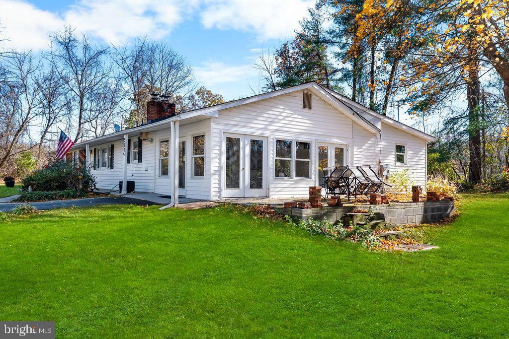 577 Brock Bridge Road Laurel, MD 20724 - Photo 36 of 41 a view of a house with a yard and chairs