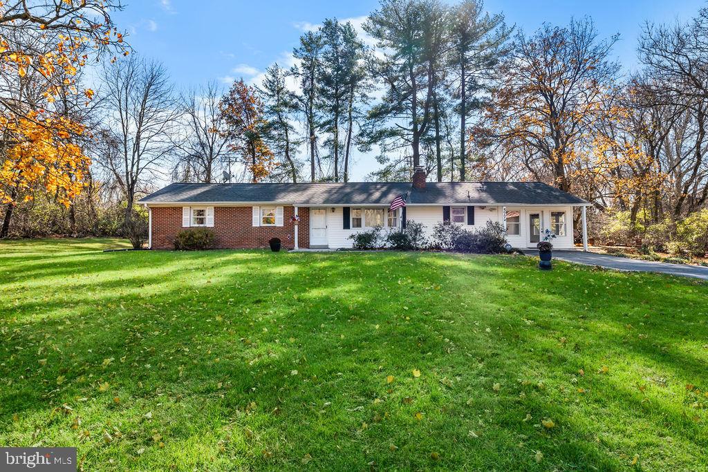 577 Brock Bridge Road Laurel, MD 20724 - Photo 39 of 41 a view of a house with a big yard and large trees