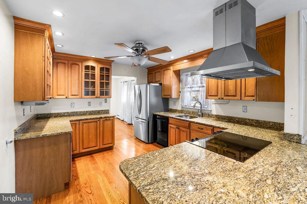 577 Brock Bridge Road Laurel, MD 20724 - Photo 5 of 41 a kitchen with stainless steel appliances granite countertop a sink a stove and a refrigerator