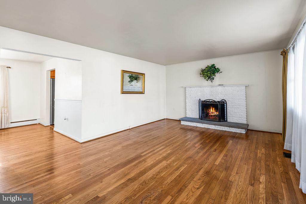 577 Brock Bridge Road Laurel, MD 20724 - Photo 7 of 41 Spacious Living Room with Wood Fireplace!
