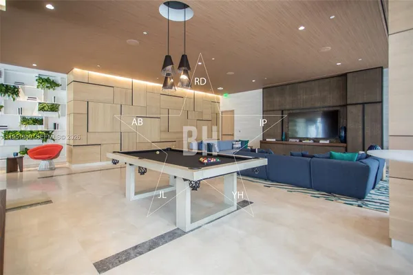 a kitchen with a table and chairs