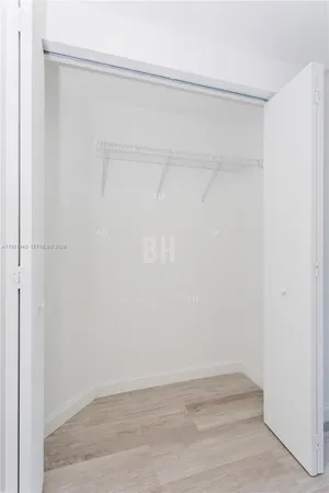 a view of an empty walk in closet