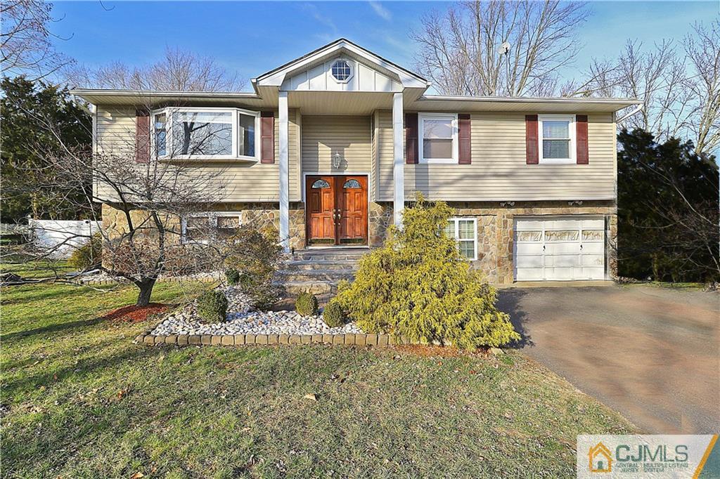 64 Valley Road Jackson, NJ 08527 - Photo 1 of 24 a front view of a house with garden