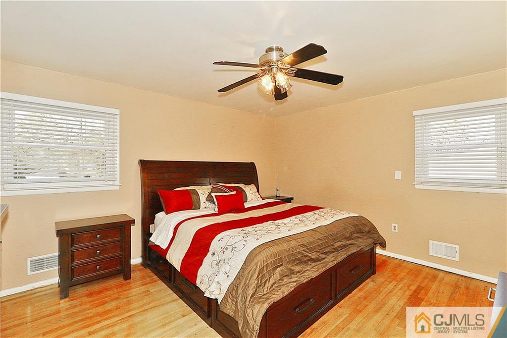 64 Valley Road Jackson, NJ 08527 - Photo 13 of 24 a bedroom with a bed and a window